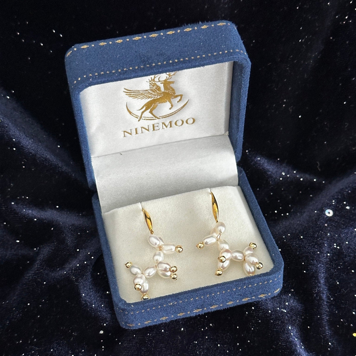 Ivory White Balloon Dog pearl earrings in a NINEMOO jewellery box