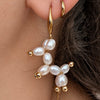 Ivory White Balloon Dog pearl earrings worn