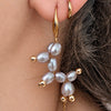 Purple Balloon Dog pearl earrings worn