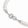 Étreinte de Perle Pearl Necklace – detail of 9 mm ivory freshwater pearls and platinum-filled Cubic Zirconia clasp