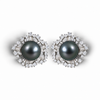 Nacre Noire Bloom earrings with dark Tahitian pearls and gemstone floral settings, mirrored pair on a white background