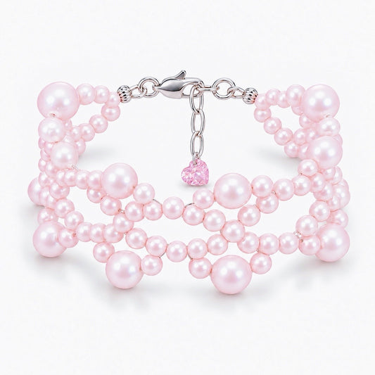 Ballet Rosé woven pink freshwater pearl bracelet with sterling silver fittings and a heart-shaped lab-grown pink diamond
