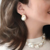Gold Flecked Baroque Pearl Silver Earrings by NINEMOO – detail view