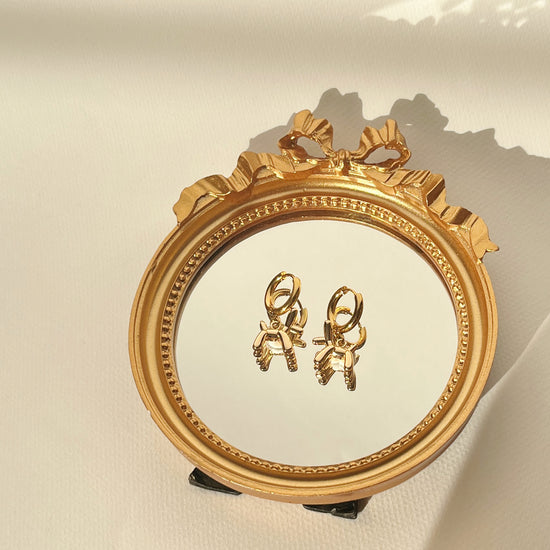 Golden Balloon Dog Hoops Earrings by NINEMOO – detail view