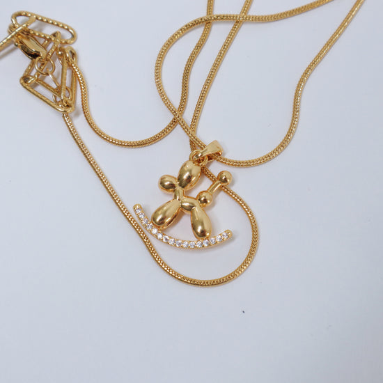 Golden Balloon Dog Necklace by NINEMOO – detail view
