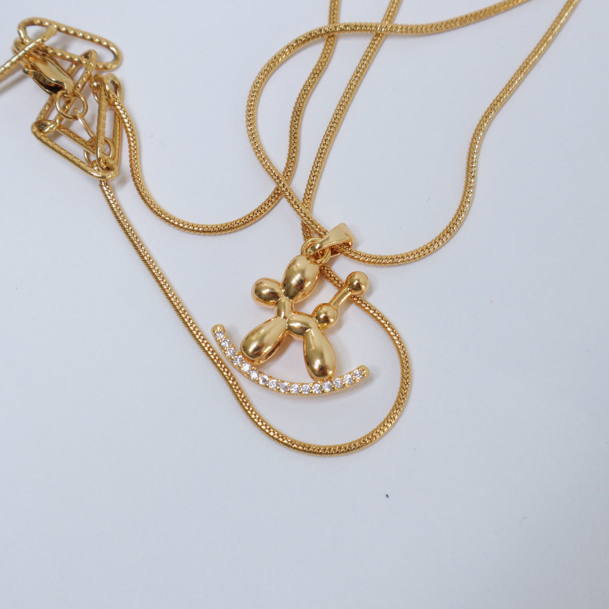 Golden Balloon Dog Necklace by NINEMOO – detail view