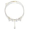 NINEMOO star pearl necklace with pearl links and a drop pendant on a white background