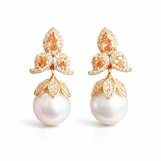 NINEMOO Iris gold-tone floral pearl drop earrings with orange accents on a white background
