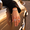 Lueur Rosée Éclat Pearl Bangle worn on the wrist