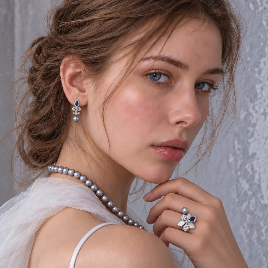 Nacre Gris Arabesque grey freshwater pearl earrings worn with bridal styling