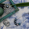 Nacre Noire five pearl necklace starburst brooch art
