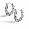 Pair of Nacre Noire hoop earrings with 4mm peacock green saltwater pearls and thick platinum plating on a white background