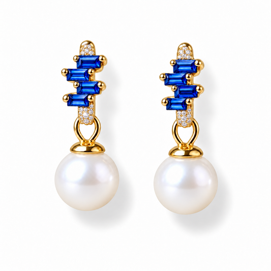 NINEMOO Prisme Blue Pearl Drop Earrings in Gold-Filled metalwork with blue Cubic Zirconia and white Freshwater Pearls, on a white background.