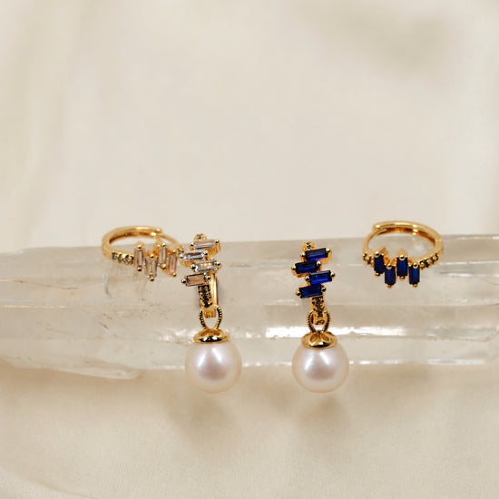 NINEMOO Prisme pearl earrings in blue and clear Cubic Zirconia, showing detachable pearl drops and hoops styled together.