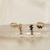 NINEMOO Prisme pearl earrings in blue and clear Cubic Zirconia, showing detachable pearl drops and hoops styled together.