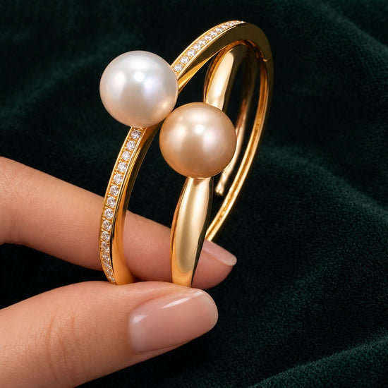 Solara golden pearl wave cuff beside Lueur Rosée Éclat gold bangle, pearl close-up
