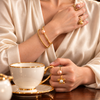 Solara Golden Pearl Wave Cuff styled on the wrist